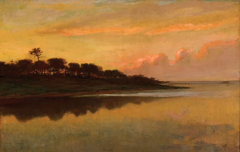 A dark wooded promontory extending into the calm St. Johns River beneath a luminous sunset